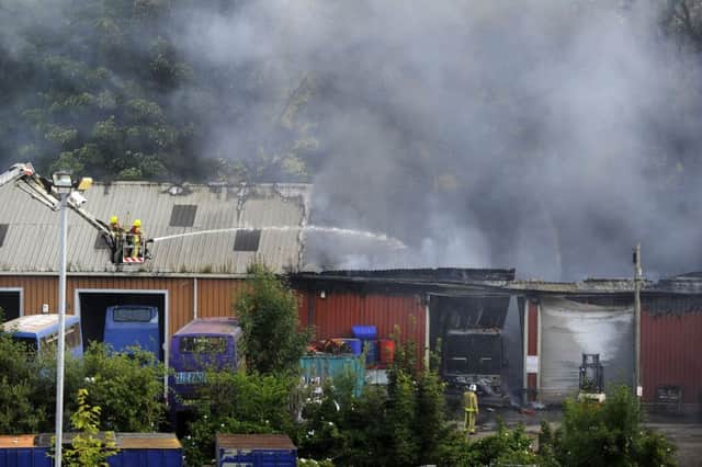 Firefighters control the fire at Geldards Coaches in Whitehall Road.  6 August 2015.  Picture Bruce Rollinson