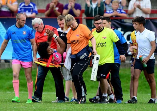 Medical staff from both clubs stretcher Bulldogs full-back Johnny Campbell from the field following his injury last Sunday.