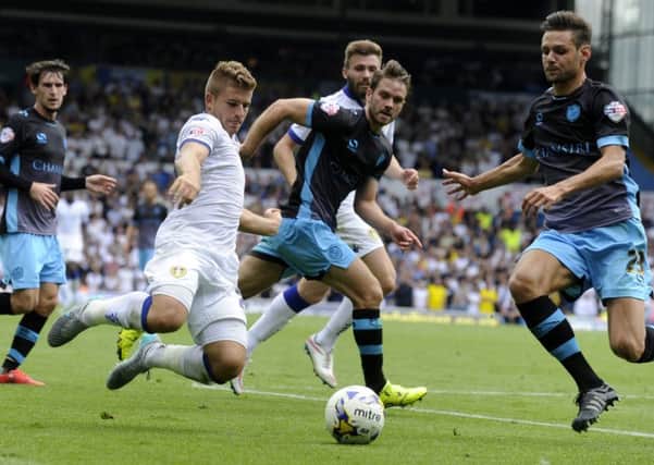 Gaetano Berardi and Vicent Sasso close in on a loose ball in Leeds United's game against Sheffield Wednesday. Picture: Bruce Rollinson