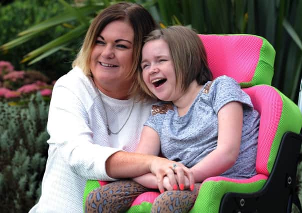 17-year-old Bethanie Price from Mirfield, who has been nominated for a Yorkshire Children of Courage Award. Bethanie had a normal childhood until she was seven years old, when she developed tremors in her arms. After many tests doctors discovered while matter on her brain and she was diagnosed with leukodystrophy, a degenerative, life-shortening condition. Pictured at the  Forget Me Not Children's Hospice in Huddersfield with her mum Johanna.
16th September2015.
Picture : Jonathan Gawthorpe