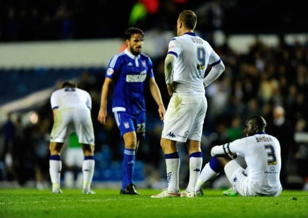 Leeds United player look dejected at the end of their game against Ipswich.