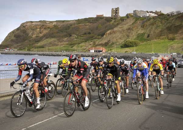 The cyclists ride to the finish at Scarborough's North Bay on day one of the 2015 Tour de Yorkshire. (Picture: Richard Ponter)