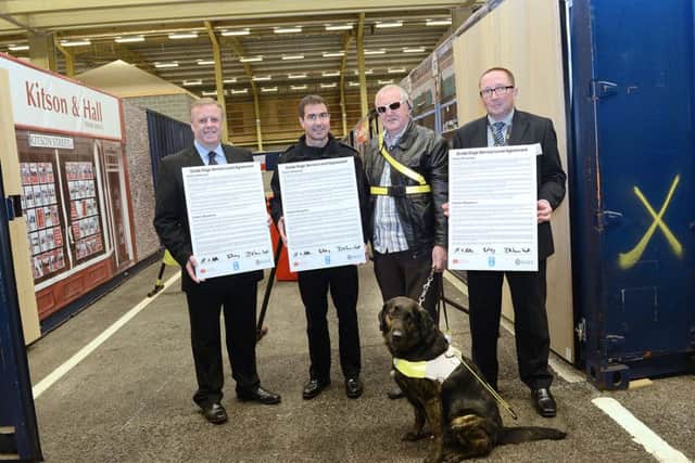 Mark Burns-Williamson, Superintendent Dave Lunn, David Quarmby with guide dog Mick and Ben Drury (head of mobility services, West & North Yorkshire Guide Dogs & Blind Children UK)