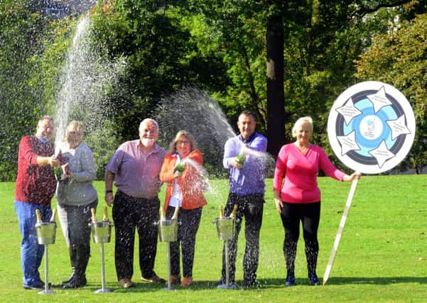 Yorkshire Lottery winners celebrate the 4,000th Lottery millionaire at Roundhay Park in Leeds. L-R: Graham and Amanda Nield from Wakefield, Rob and Elaine Leason from Driffield and  Michael and Susan Crossland from Mirfield. Pictures: Gary Longbottom (GL1007/47b)