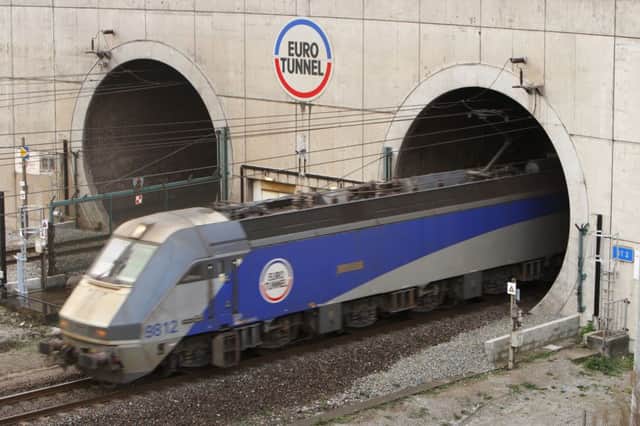 File photo dated 17/11/09 of a train leaving the Eurotunnel at Coquelles in France, as Channel Tunnel travellers are experiencing a second day of disruption following Monday's overhead power line problem. PRESS ASSOCIATION Photo. Issue date: Tuesday July 8, 2014. Four of the high-speed Eurostar train services had to be cancelled today and there were delays to the Folkestone to Calais shuttle services. Eurostar said passengers who had a booking on a cancelled train could exchange their ticket, free of charge, for another available service within the next four months. See PA story RAIL Delays. Photo credit should read: Chris Ison/PA Wire