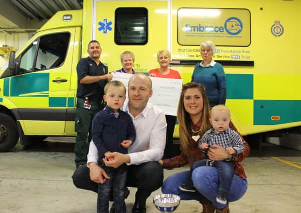 Embrace staff accept the cheque from the Blakeley family. Pictured are back l-r Embrace driver and Embrace nurse with Finleys two grandmas (I dont know their names but I can get them no prob if you need them) and front l-r Louie, Chris, Jenna and Finley.