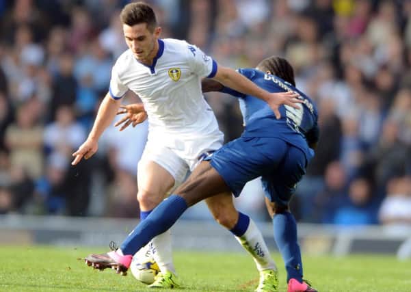 Lewis Cook up against Clayton Donaldson in Leeds United's latest game against Birningham City.
