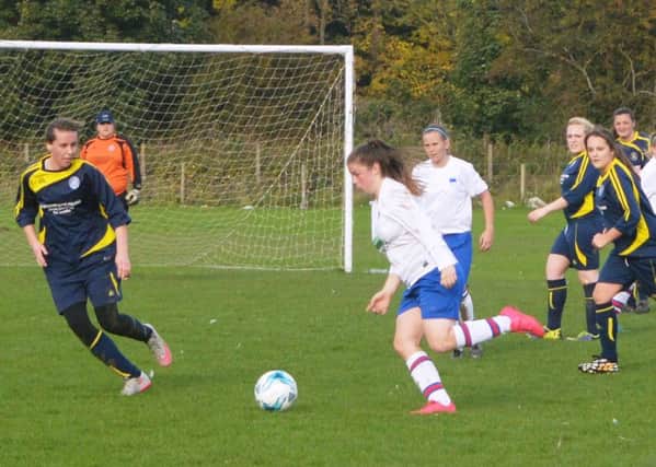 Katie Clarkson runs at the Ilkley defence on her way to scoring a hat-trick.