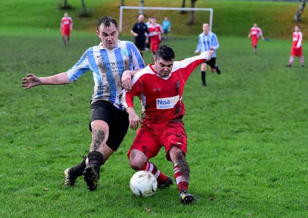 Mark Mullins, of Marsh, makes a challenge on an Eastmoor attacker during Saturday's Wakefield League clash.