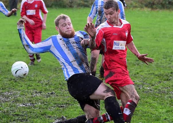 William Sharp makes a challenge for Marsh in Saturdays Wakefield League clash against Eastmoor. Pics: Paul Butterfield.