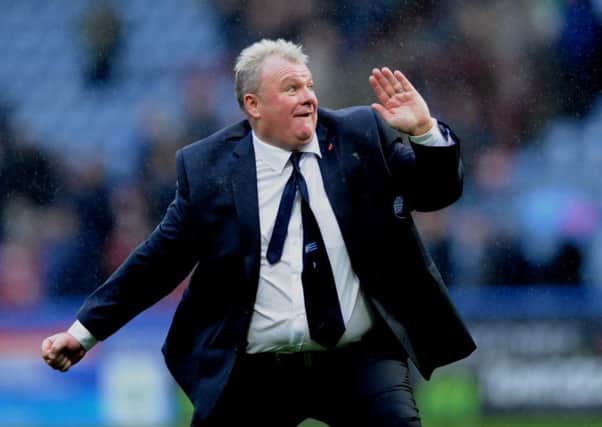 Steve Evans salutes Leeds United fans after the win at Huddersfield Town. Picture: Simon Hulme