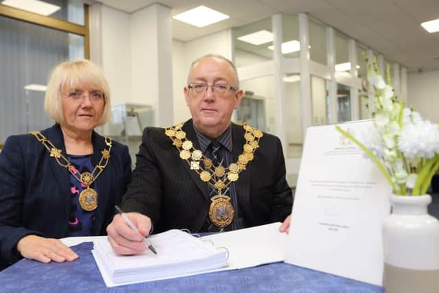 Mayor and Mayoress of Kirkless Paul Kane and Susan Bedford with the book of condolence at Dewsbury Town Hall.
