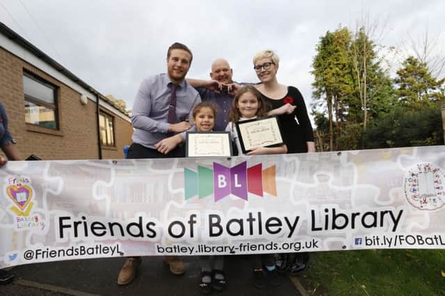 Batley Parish School pupils Lilly-Mae Kennedy and Tegan Grant get a thank you from Simon Roadnight, the chairman of the recently formed Friends of Batley Library with Matthew Carbutt (assistant head teacher) and Amy Hearn (librarian at Batley library)
