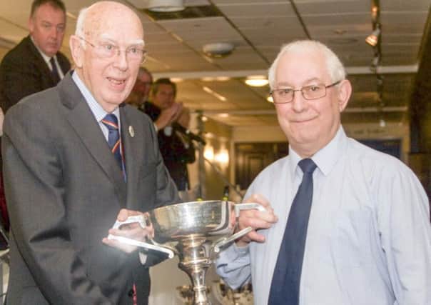 Cleckheaton stalwart Bob Speight receives the Len Hutton Trophy from Bradford League President Keith Moss