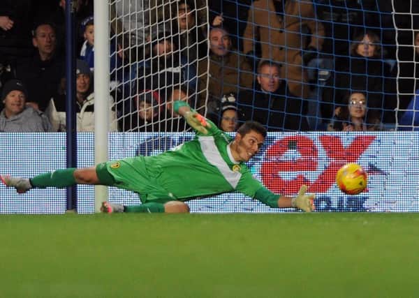Leeds United' goalkeeper Marco Silvestri makes a save for Leeds United at QPR. Picture: James Hardisty