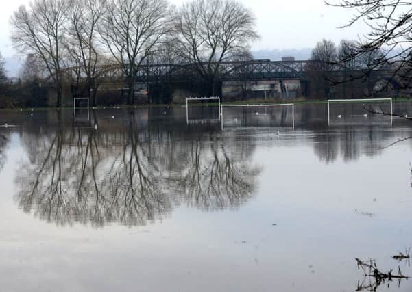 The scene at Sands Lane in Dewsbury after the River Calder burst its banks and left the football pitches flooded last Sunday.  The venue will be out of action until  the new year.Picture: Steve Riding