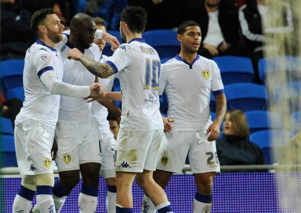 Leeds United players celebrate Souleymane Doukara's goal at Cardiff.
