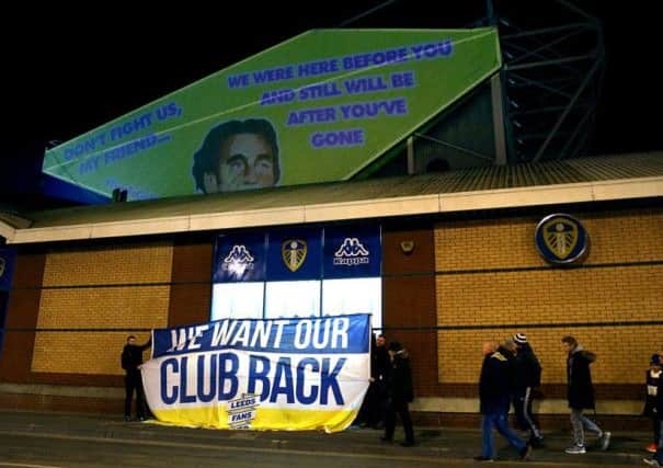 Earlier projections and a banner, in protest of Leeds owner Massimo Cellino, at Elland Road.s