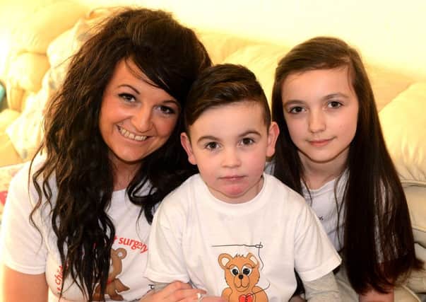 Fundraisers Alfie with sister Chloe and mum Emma. (d624a507)