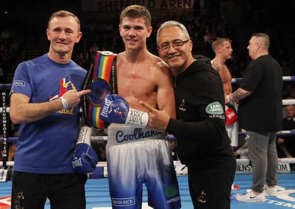 Luke Campbell receives the Commonwealth belt as trainer Sean OHagen offers consoling words to Gary Sykes in the background. Picture:  Lawrence Lustig