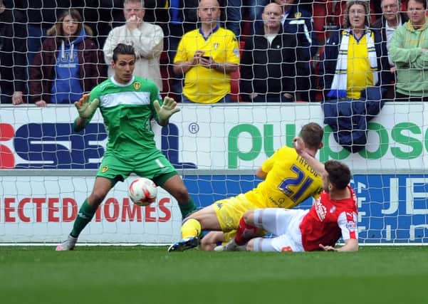 Rotherham's Lee Frecklington slides in to poke home a first half goal against Leeds United. Picture: Tony Johnson