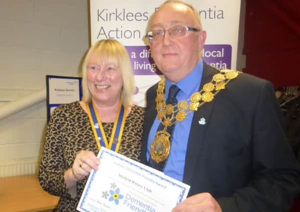Mirfield Rotary president Sue Charlesworth receives dementia friendly accreditation from Mayor of Kirklees Coun Paul Kane.