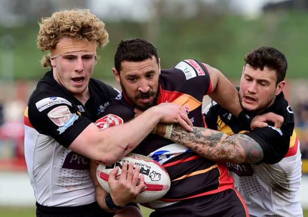 Dewsbury stand-off Paul Sykes attempts to break through the Bradford Bulls defence. Picture: Paul Butterfield