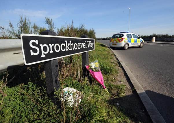 Flowers at the scene of the crash at Sprockhoevel Way.