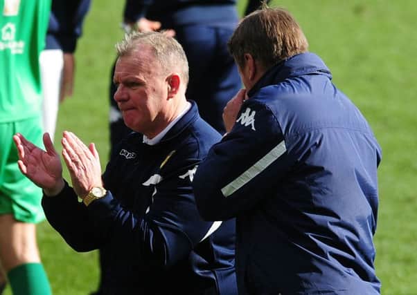Leeds United's head coach Steve Evans with assistant Paul Raynor at the end of the last home game of the season.