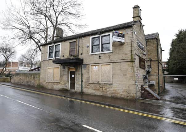 The George pub has been boarded up for more than a year.