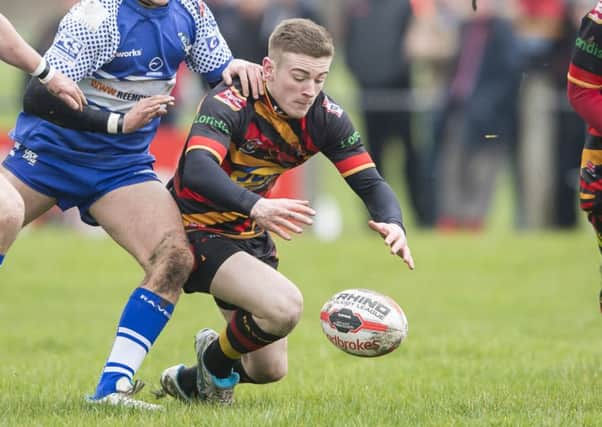 Sam Ottewell added to his impressive scoring tally with a brace of tries as Shaw Cross Sharks overcame leaders Oulton Raiders last Saturday.