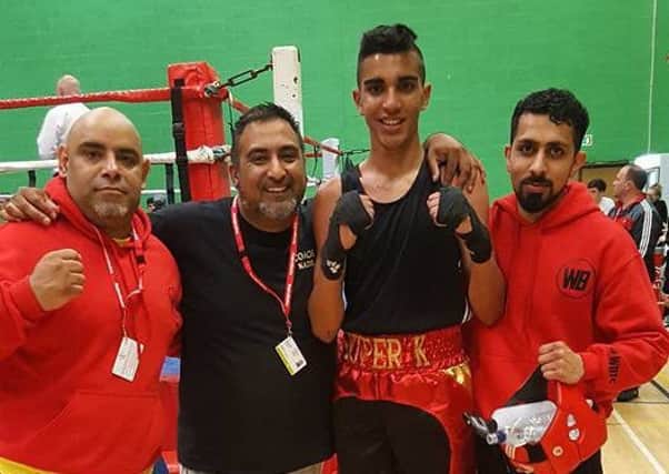 Warrior Breed boxer Khalid Ayub with coaches  Zahir Akbar, Kadir Khan and  Adam Bham following his National Schoolboy title victory.
