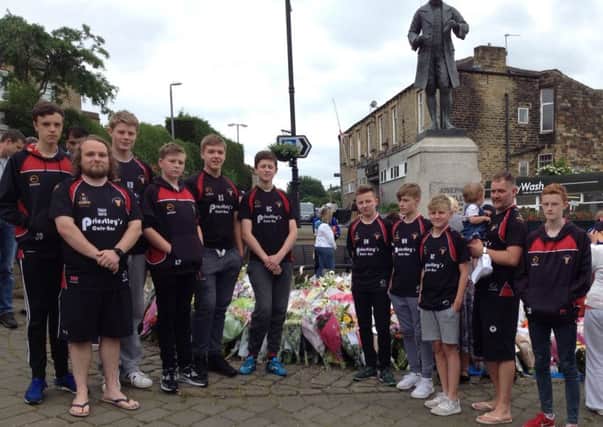 Birstall Victoria Under-14s paying respect to murdered Batley and Spen MP Jo Cox after last Sundays game against Dudley Hill which they won 30-26 .