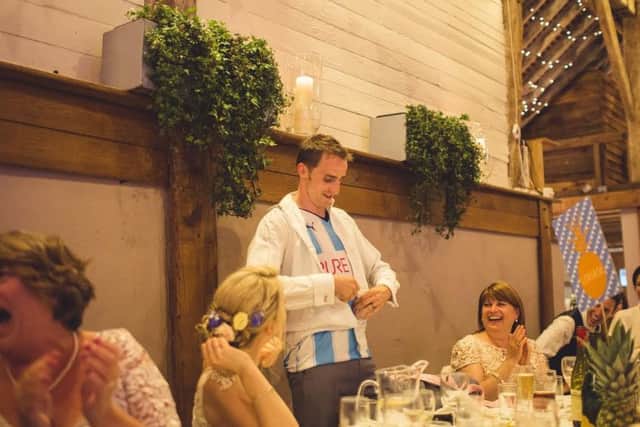 Mark Silvester makes the day for his new father in law, David Fleming, by stripping off his shirt and jacket during his speech to reveal that he had taken his vows secretly wearing a Huddersfield Town jersey. (Picture Ross Parry)
