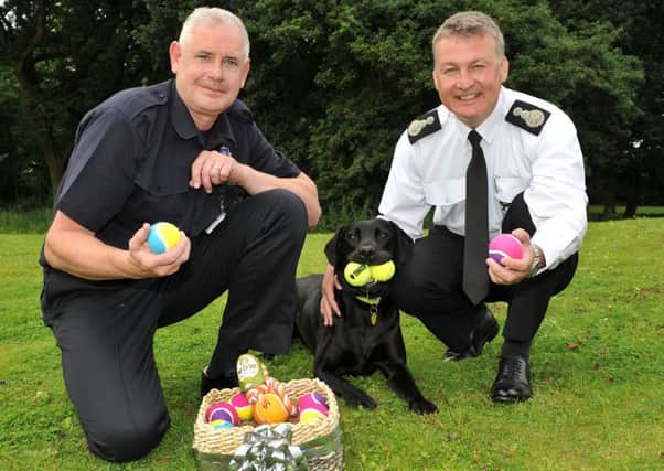Nigel Gill, Chief Fire Officer Simon Pilling and Eddie with his treats from Pets at Home in Birstall. (Photo WYFRS)