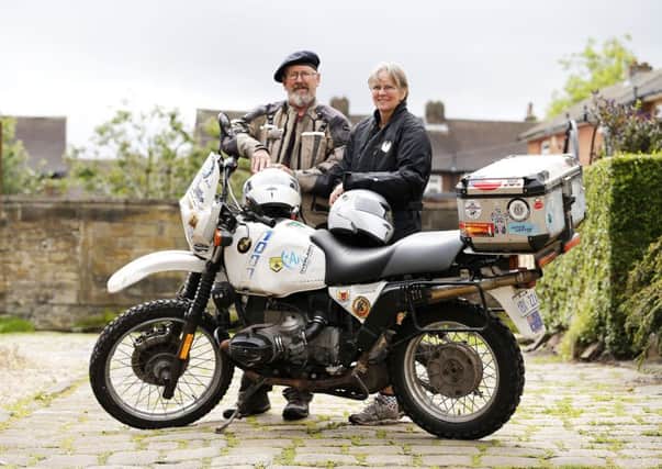 Dewsbury couple Sam and Stew Saunders who started a world tour on a motorbike on 1989 have just completed the second half and have stopped off in Dewsbury.
