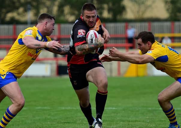 Mitch Stringer looks to set up a Dewsbury Rams attack against Swinton last Sunday. Pictures: Paul Butterfield