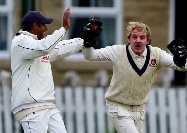 Cleckheaton wicketkeeper Mally Nicholson celebrates claiming the wicket of Scholes captain James Stansfield