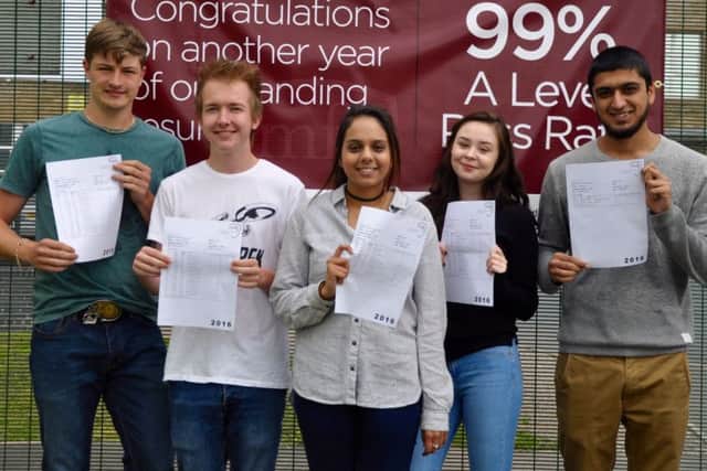 Students from the Mirfield Free Grammar Sixth Form show their results.