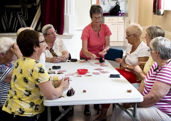 Ladies enjoy a game of cards during one of the centres Wednesday afternoon sessions. Picture by Mike Bettney.