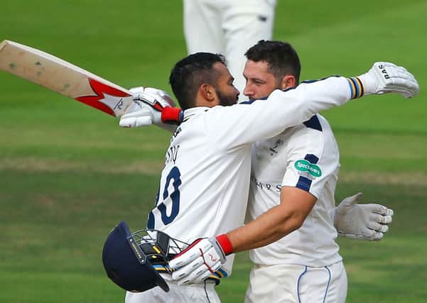 Tim Bresnan is embraced by Azeem Rafiq after reaching his century for Yorkshire against Middlesex (Picture: Alex Whitehead/SWpix.com).