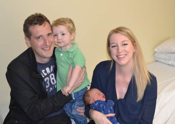 Baby Joseph Lloyd with dad Jonathan, mum Amy and brother George.