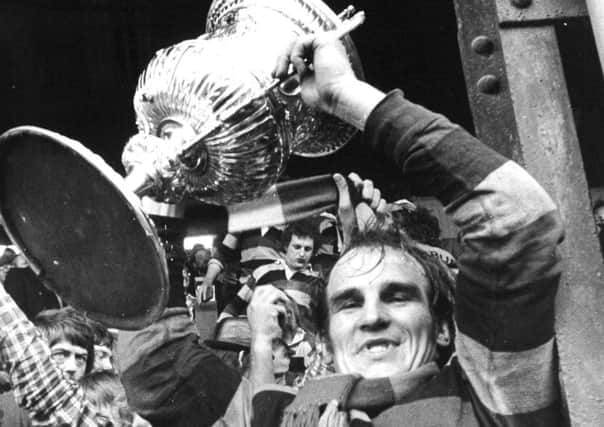 Mike Stephenson lifts the 1973 Championship trophy for Dewsbury