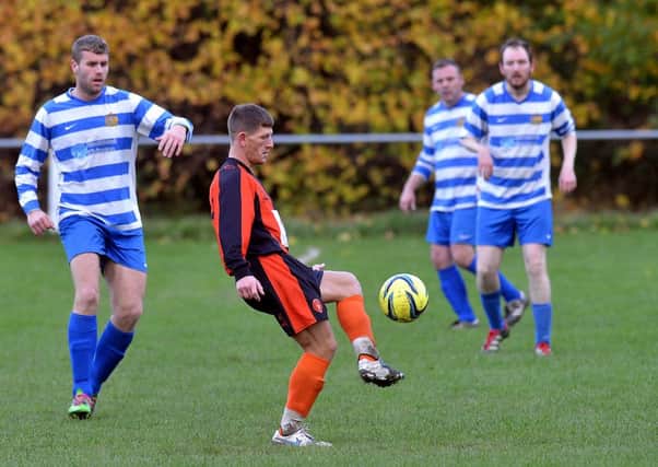 Action from last Saturday's Jim Callaghan Cup tie between Wakefield City and Crown Gawthorpe.