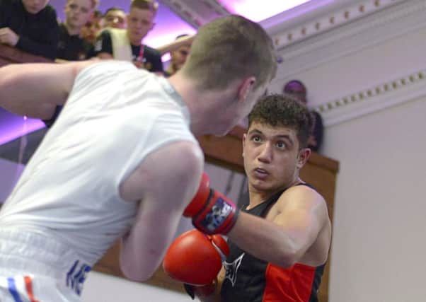 KBW boxer Huzaifa Khan on the attack during a thrilling CYP Championships bout against Sheffields Rhys Lewicky last weekend.