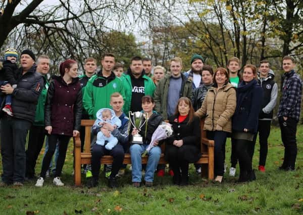 Family and friends gather at the new bench in memory of Jonny 'Chippa' Peacock, who died earlier this year.