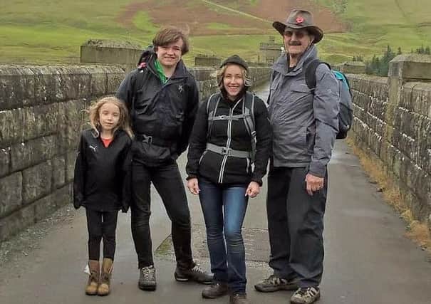Colin Watts, who walked a 20-mile challenge after having a knee replacement and fracturing his other knee. Pictured with his daughter and grandchildren.