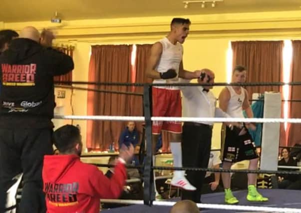 Warrior Breed boxer Amaar Akbar celebrates beating James McMeekin to reach the National Amateur Boxing Championships quarter-final.