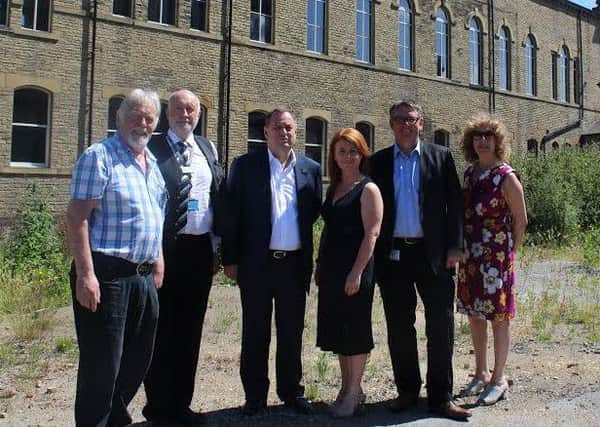 Dignitaries gather at the Pioneer House site which forms part of Kirklees College's plans for a new 'learning quarter'.