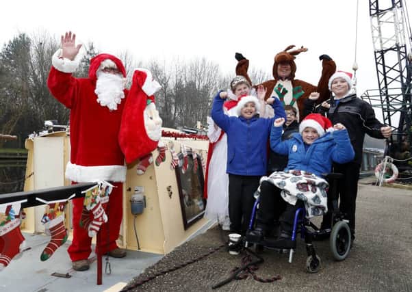 Santa Anchor Trust's, giving disadvantaged kids presents at Shepley Bridge Marina